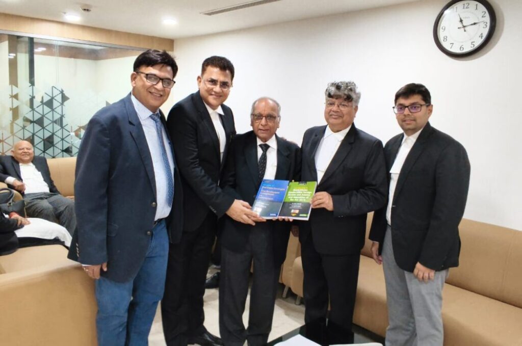 Dr. Rakesh Gupta & Somil Agarwal presenting Tax books to the President of ITAT Bar Association, Delhi,